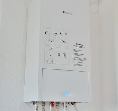 High-quality image of a modern water heater system in a residential utility room, emphasizing professional installation and repair services offered in Boerne, TX.