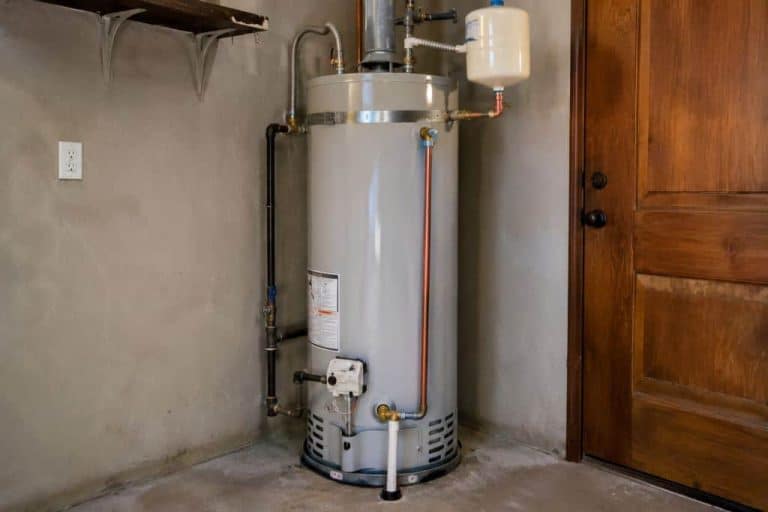 Gas water heater installed in a residential utility room for water heater repair service in Boerne, TX.