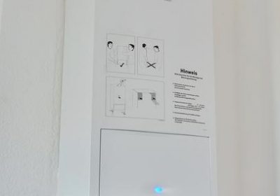 High-quality image of a modern water heater system in a residential utility room, emphasizing professional installation and repair services offered in Boerne, TX.